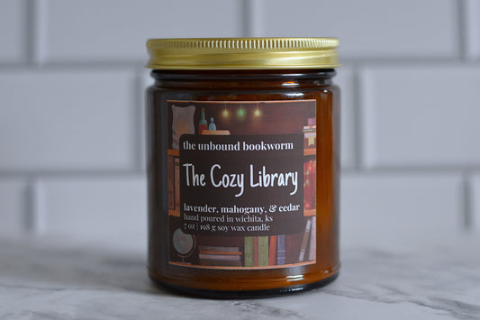 Lavender, mahogany, and cedar scented book candle titled "The Cozy Library"
